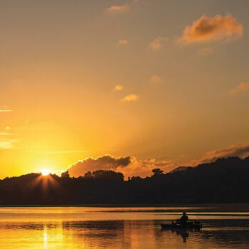 Man fishing during sunset on Lake Junaluska