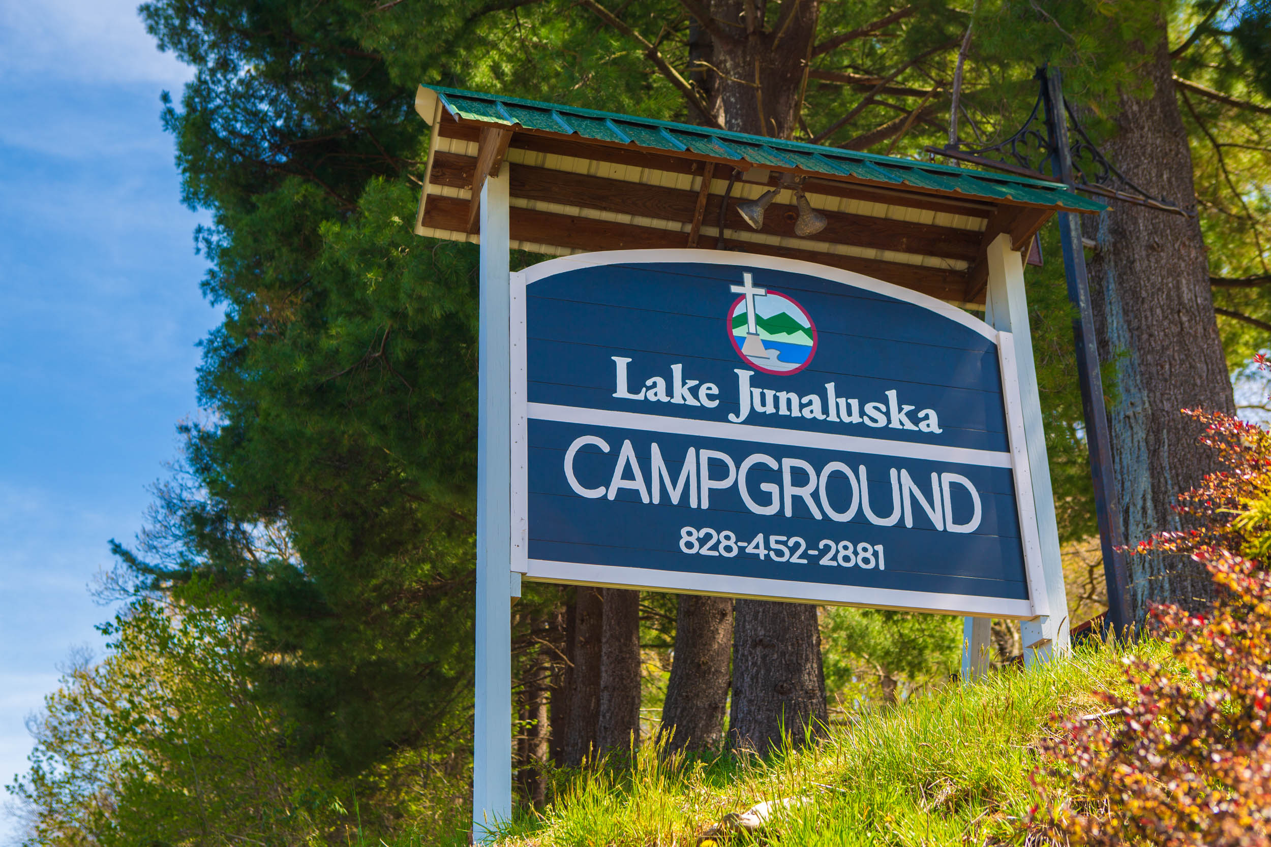 Photo of Lake Junaluska Campground sign with reservations phone number: 828-452-2881