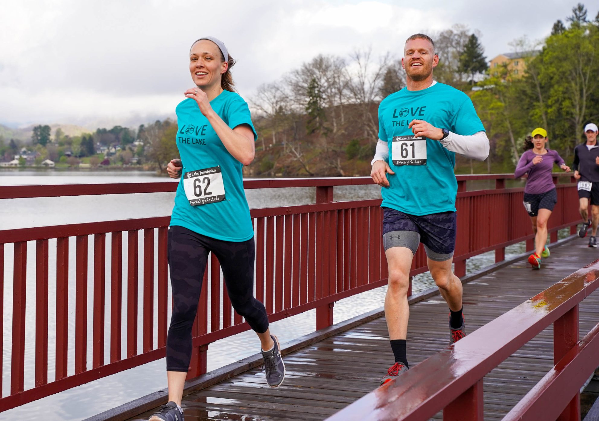 Friends of the Lake 5K runners cross a bridge