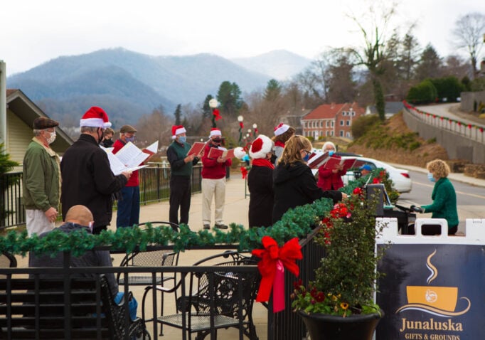 Carolers singing in front of Junaluska Gifts & Grounds
