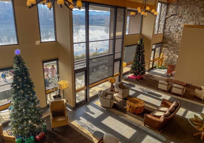 Festive lobby with scenic lake view at The Terrace Hotel during the holidays