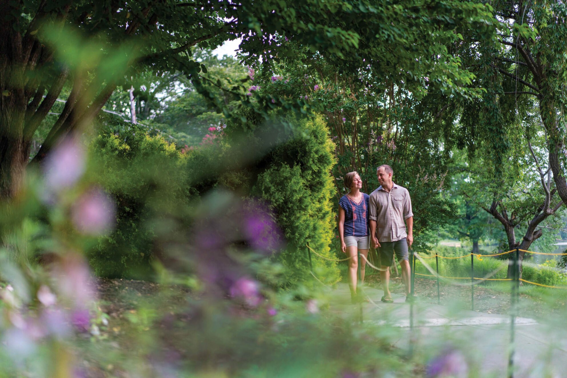 Couple walking through the gardens