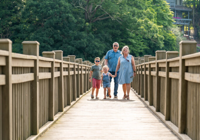 family walking on bridge