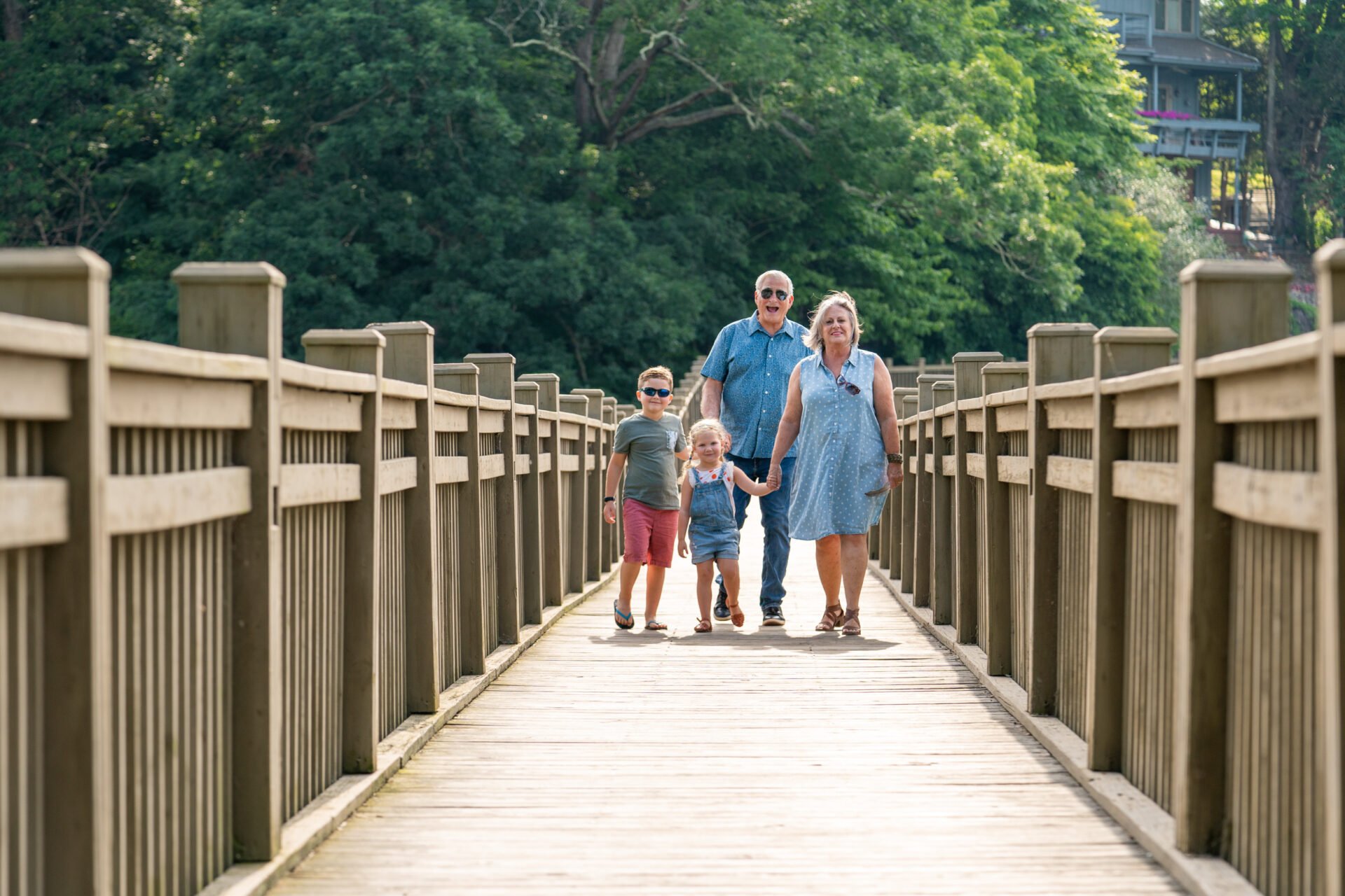 family walking on bridge