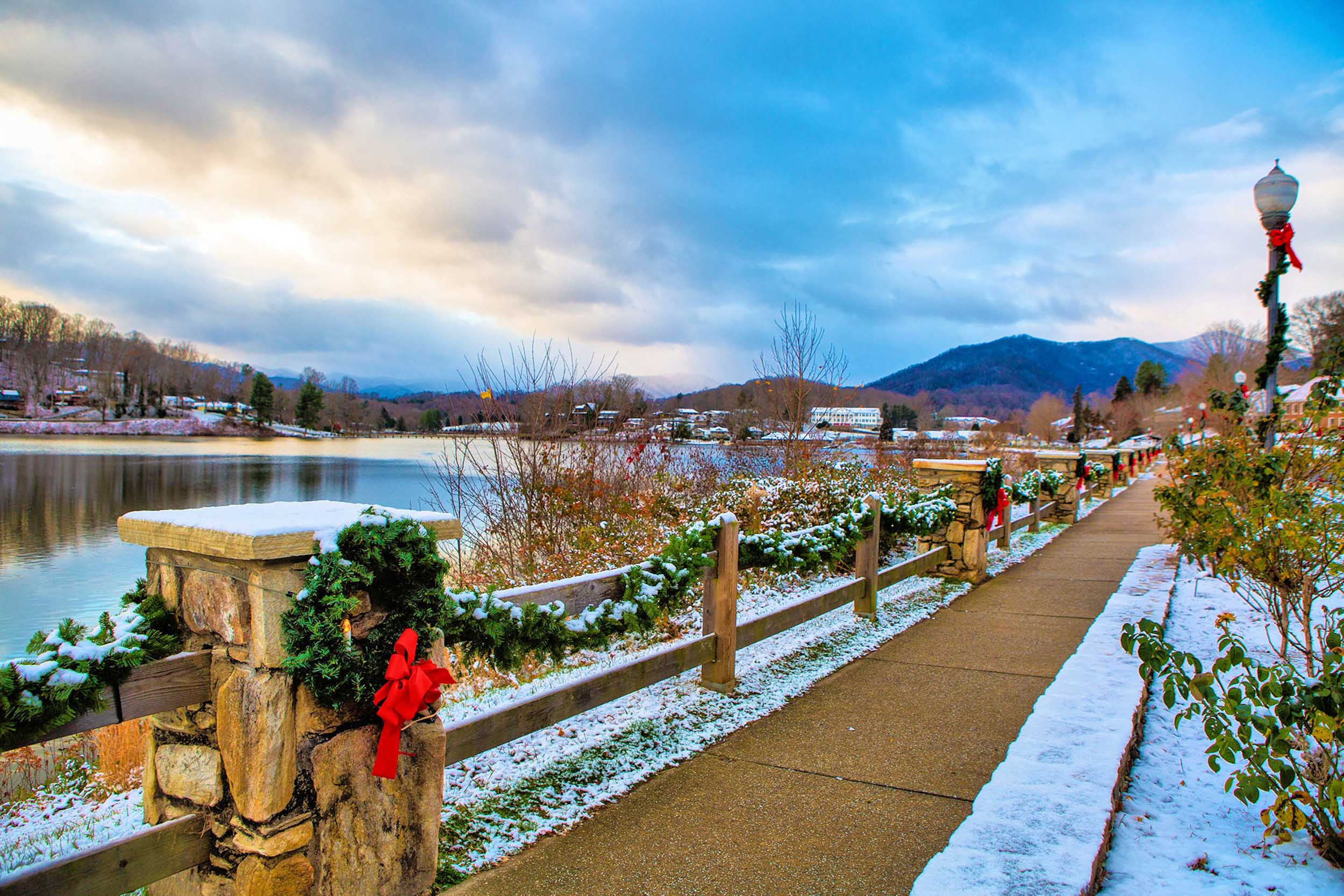 holiday decorations and snow on rose walk