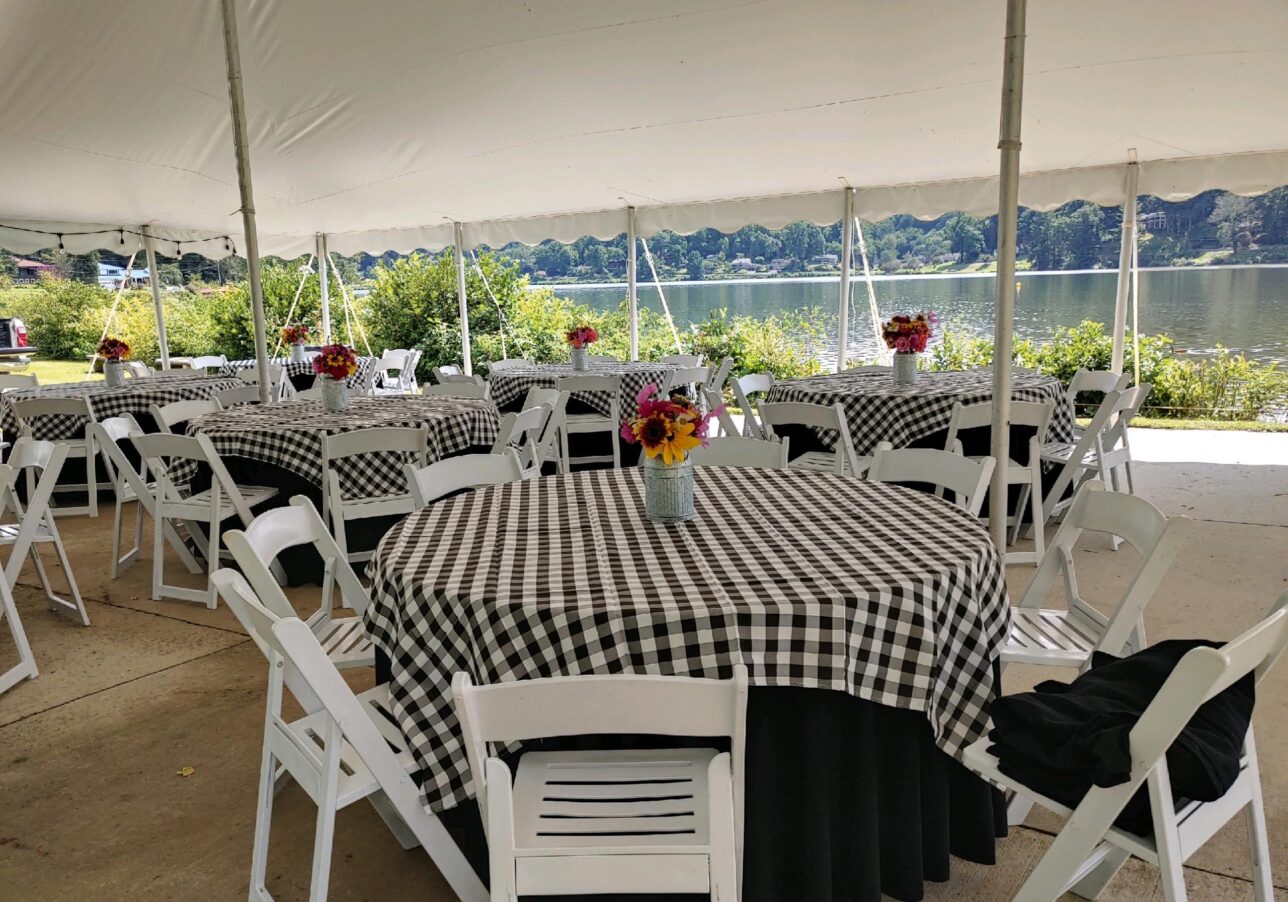 Lakeside Tent with Black Checkered Tablecloth Tables Set-up