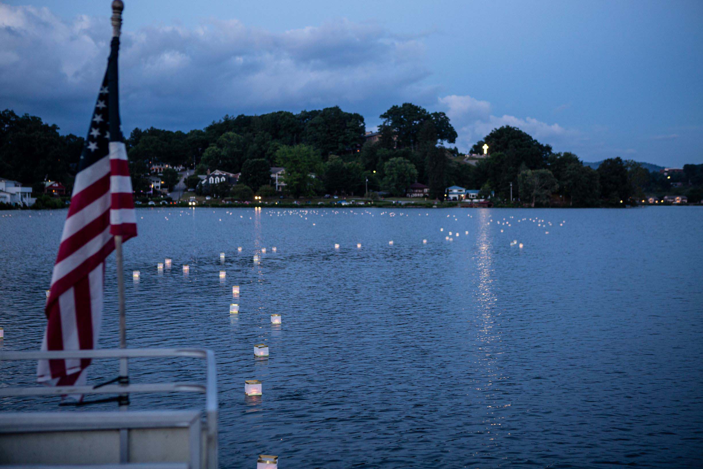 Floating Wish lanterns glimmer on the lake