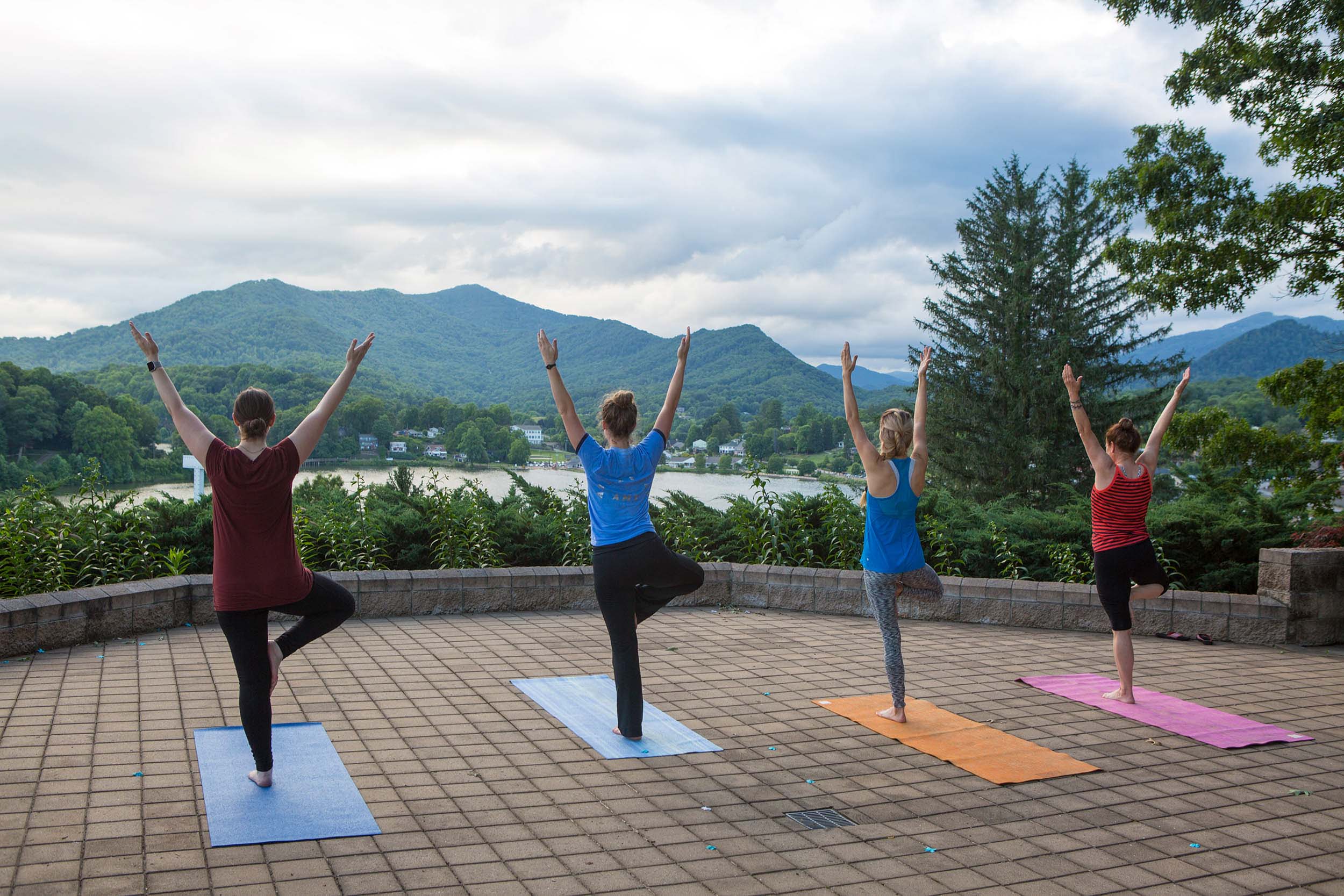 Premium Photo  Girl in a light tracksuit doing yoga in the park in the  afternoon in the summer