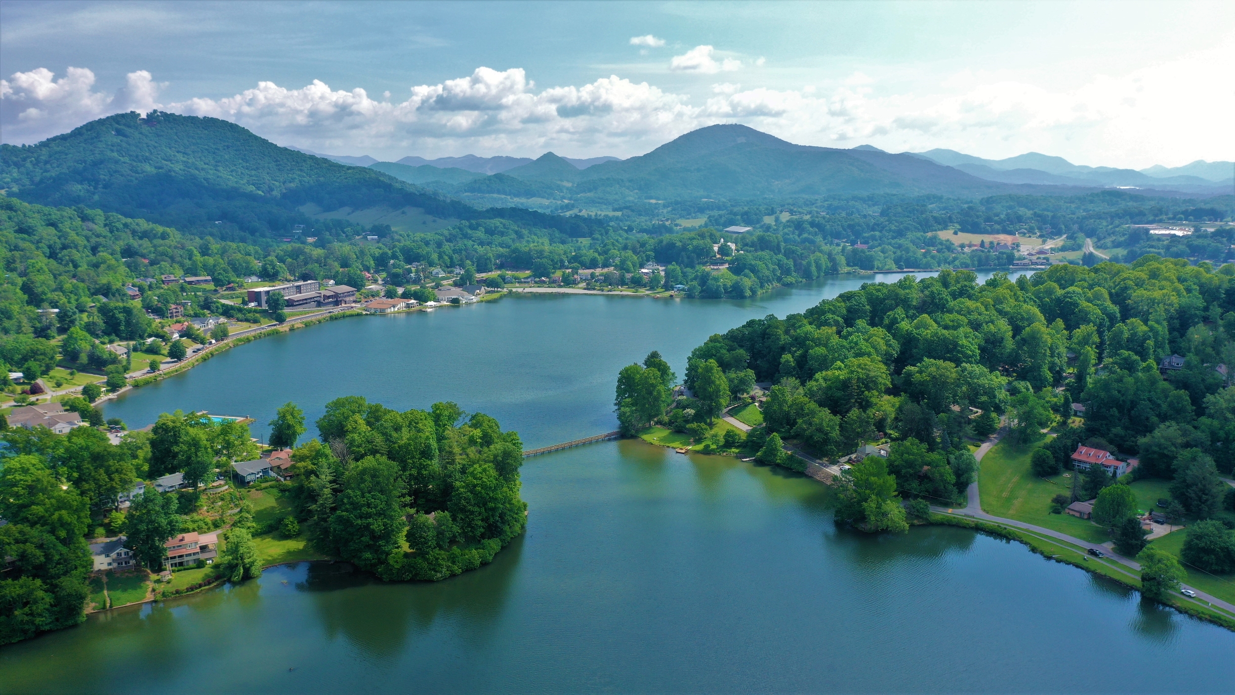 lake junaluska aerial photo with lush green trees and clear blue water