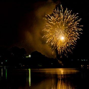 Fireworks reflect on the water at Lake Junaluska