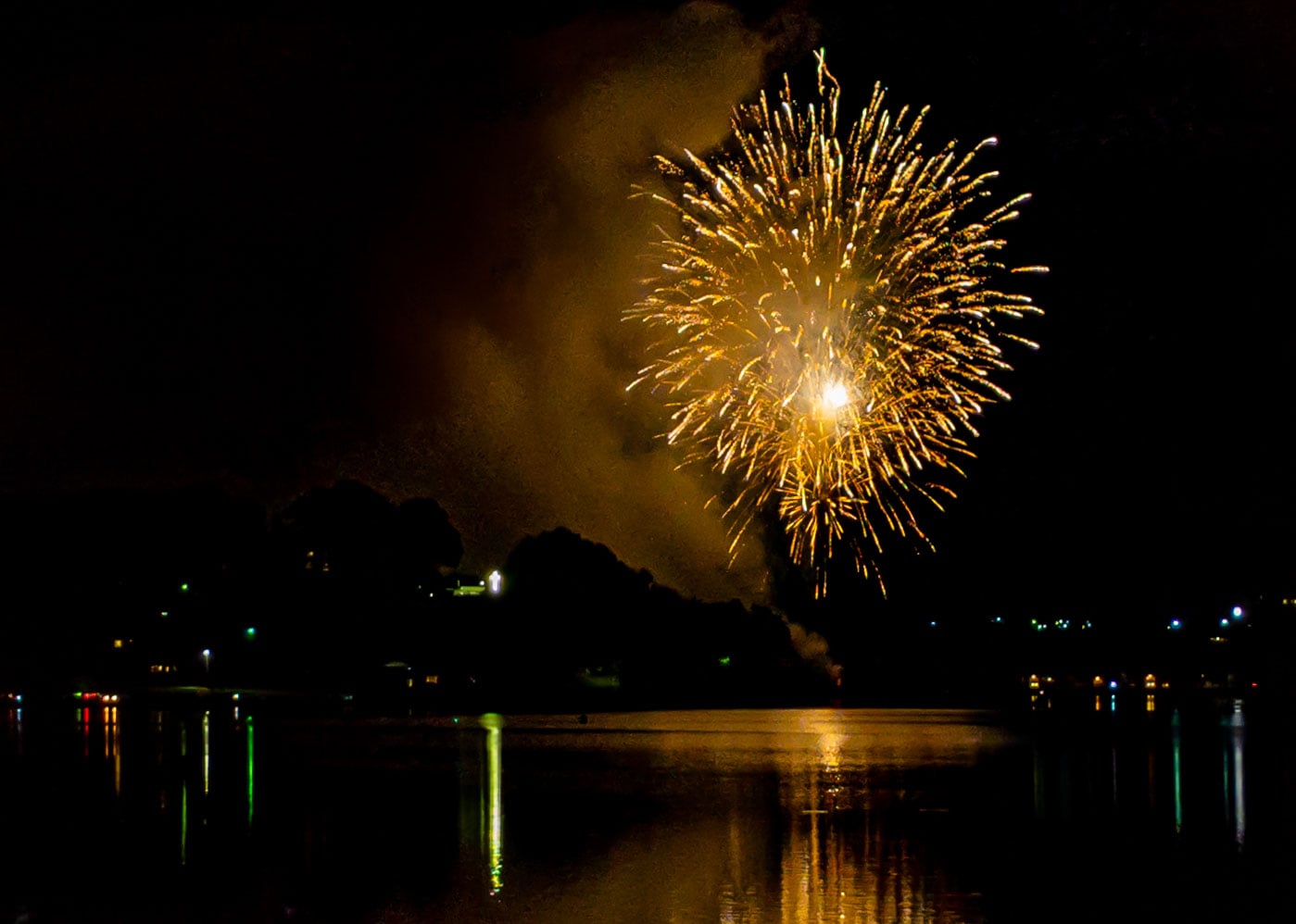 Fireworks reflect on the water at Lake Junaluska