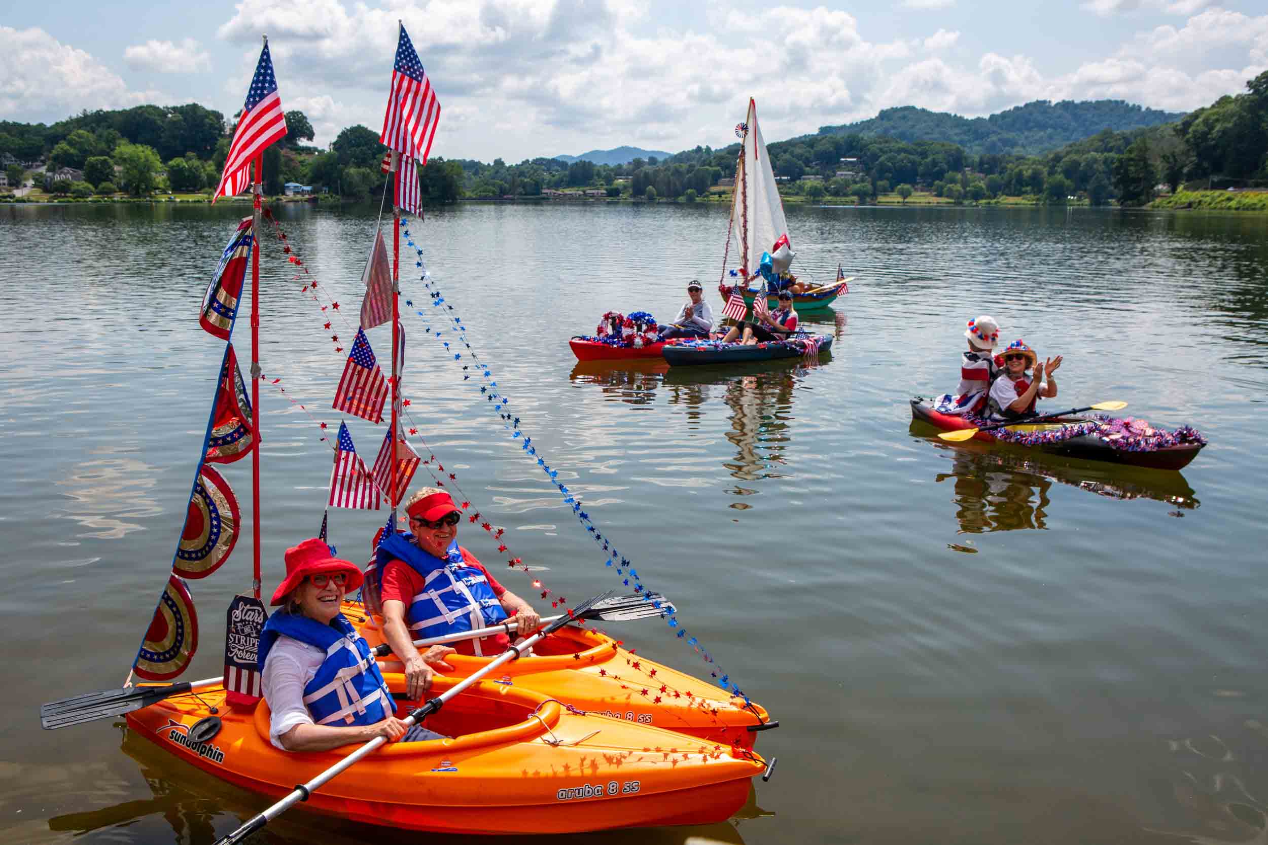 A decorated kayak/canoe/paddleboard flotilla is part of the Independence Day Celebration at Lake Junaluska.