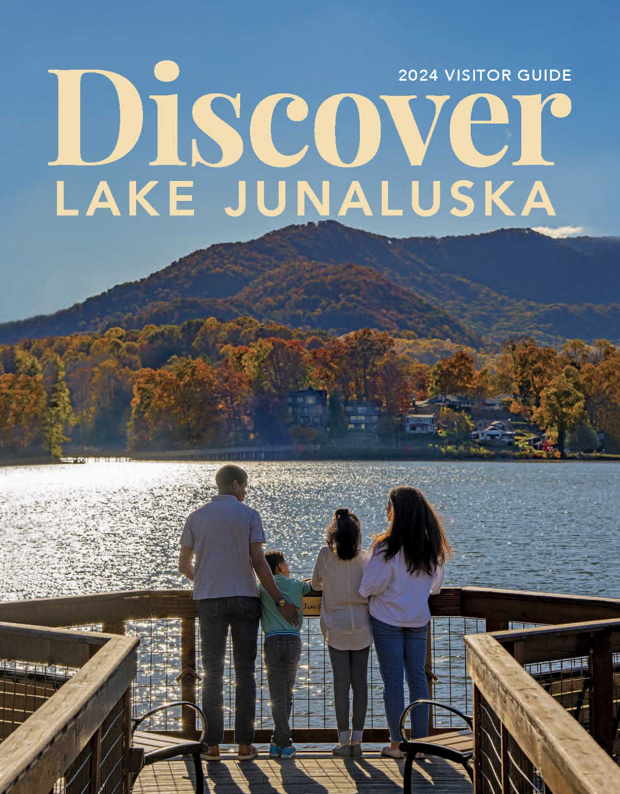 The cover photo of Discover Lake Junaluska shows a family spending time together on the meditation pier looking out at the lake.