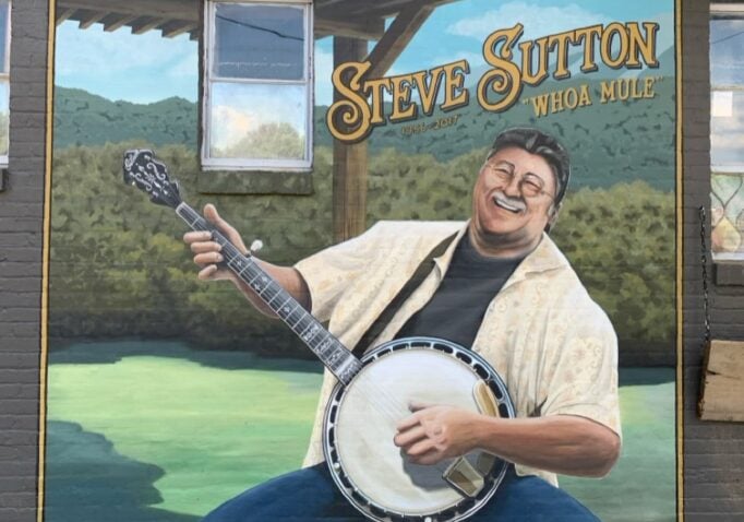 Mural of Steve Sutton playing a banjo