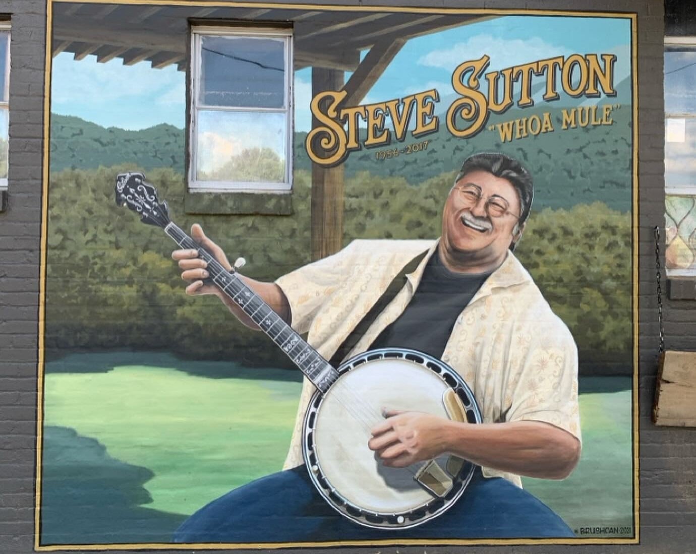 Mural of Steve Sutton playing a banjo