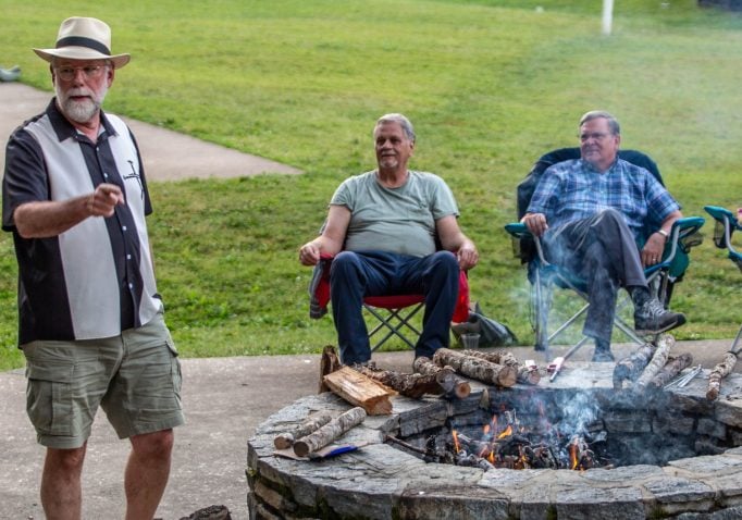 Uncle Ted White tells stories around the firepit at Lake Junaluska.